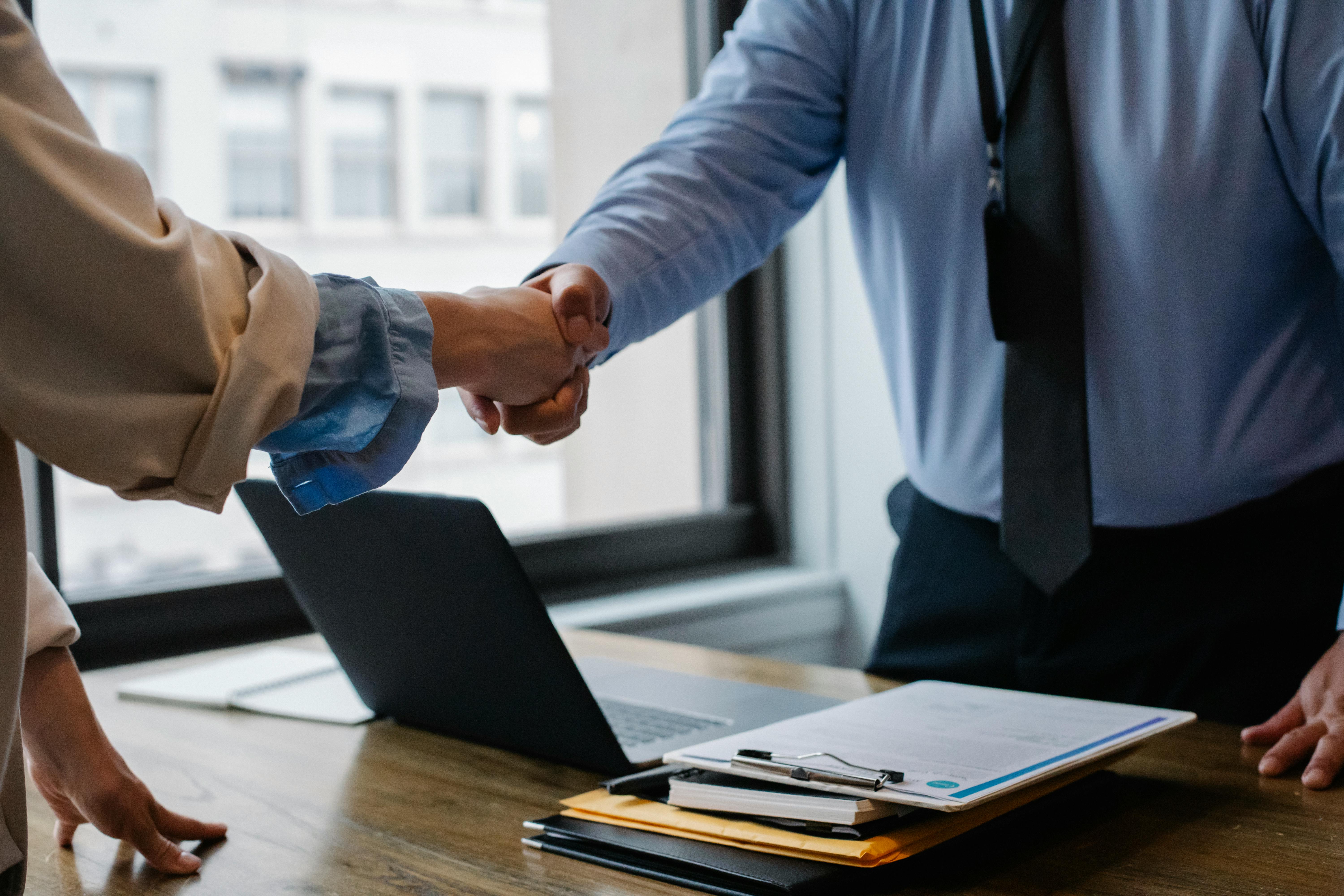 Man and woman shaking hands